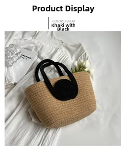 Detail of hand-woven khaki tote bag with black rope handles and white tulips