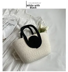 Detail of minimalist woven tote bag in white and black with elegant tulip decoration