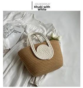 Detail view of the khaki hand-woven cotton rope tote bag with ivory round accents