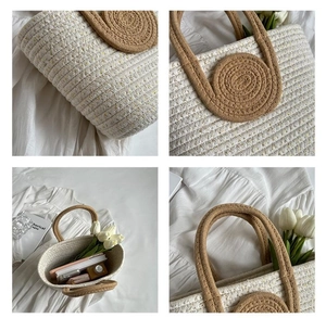 Macro view of woven tote bag showing cotton rope texture and contrast handle stitching