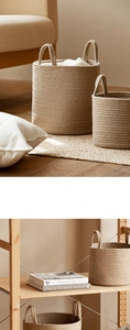 Detail of woven cotton rope storage baskets with handles in various sizes for home organizing