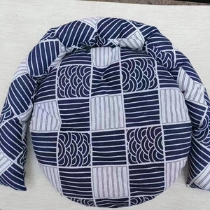 Detail of woven cat bed with navy blue seigaiha pattern and thick cotton texture