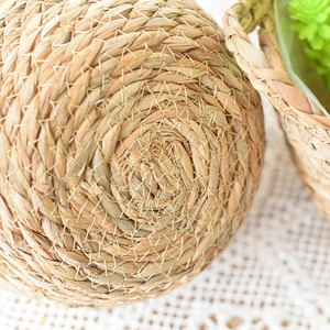 Macro shot of durable seagrass basket showing spiral weaving technique and reinforced stitching