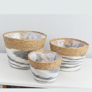 Set of three nesting woven baskets with waterproof liners for indoor plants and decor