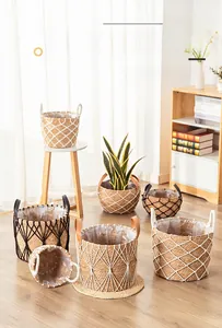 Detail of woven seagrass plant baskets with waterproof lining and leather handles