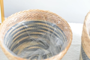 Detailed view of woven seagrass basket featuring blue stripes and waterproof plastic liner