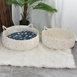 Detailed close-up of woven cotton cat bed set with cute cat ear design and blue soft mat