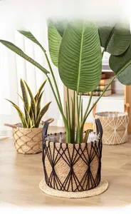 Close-up of woven seagrass plant basket with leather handle and waterproof inner liner