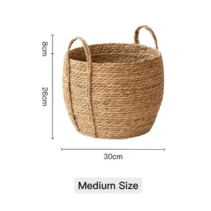Detail of medium-sized handmade seagrass basket with sturdy handles for storage