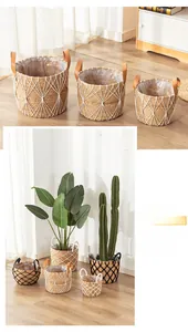 Detailed macro view of woven seagrass plant baskets with waterproof lining and leather handles