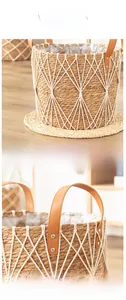 Close-up of woven seagrass plant basket with leather handles and diamond mesh detail