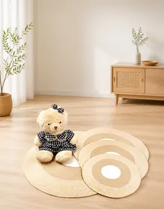 Detailed close-up of handmade woven round cotton rugs with concentric dual-tone design