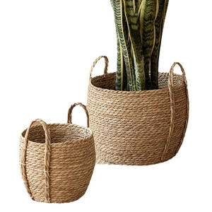 Set of two woven seagrass baskets with handles for plants and home storage