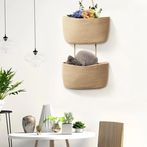Detail of double-tier woven hanging storage basket made of natural cotton rope