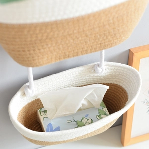 Detailed view of handmade dual-tier woven cotton rope hanging basket with two-tone design