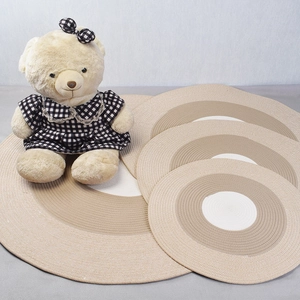 Nordic handmade round cotton woven rugs and coasters in beige and khaki tones