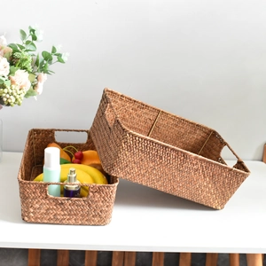 Set of two rectangular hand-woven seagrass storage baskets with handles for home decor