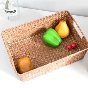 Detail view of a rectangular hand-woven seagrass basket with natural plant fibers and textures