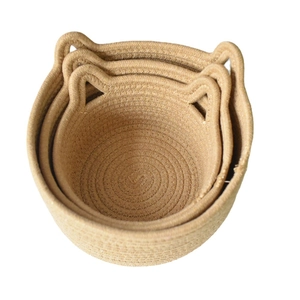 Three-piece nesting cotton rope storage baskets with cute cat ear handles in natural beige