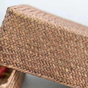 Close-up of tight weave pattern on natural brown handmade rattan storage basket