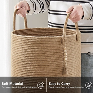 Detail of woven jute storage basket with wooden bead tassel and sturdy handles