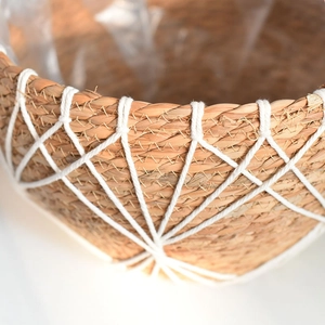 Detail of hand-woven seagrass planter with white cotton mesh and waterproof lining