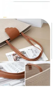 Detail of woven cotton tote bag showing brown leather handles and tight stitching