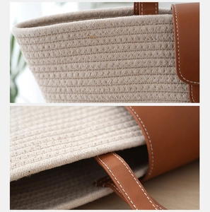 Macro detail of handwoven beige cotton rope bag with premium brown leather trim and stitching