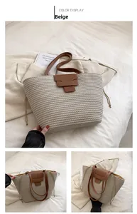 Close-up of beige woven tote bag with brown leather flap and stylish drawstring detail