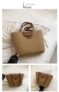 Detail of khaki woven tote bag with brown leather strap and side drawstring on white bed