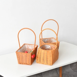 Handwoven rectangular and oval wicker baskets with handles and waterproof liners