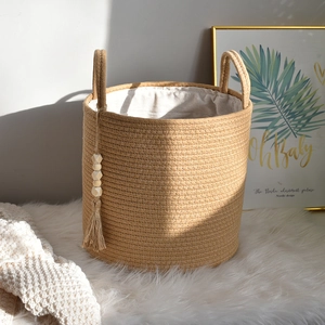 Extra large woven cotton rope laundry basket with dual handles and tassel charm