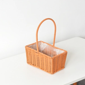 Detail of hand-woven plastic rattan flower basket with handle and waterproof lining