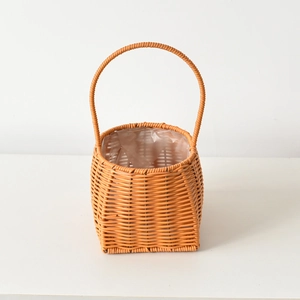 Close-up of woven basket with waterproof plastic lining for floral arrangements