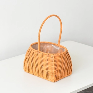 Detail of hand-woven flower basket with durable top handle and waterproof plastic liner