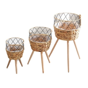 Three-piece Nordic rattan woven plant stands with solid wood legs and waterproof liners
