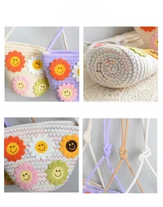 Détails du sac seau en paille tressée avec fleurs de soleil et fermeture éclair