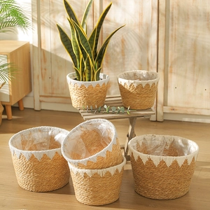 Nordic woven plant baskets with white wave patterns and waterproof plastic linings