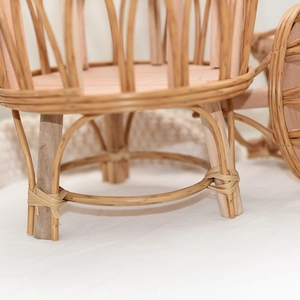 Close-up of Nordic style hand-woven rattan basket showing solid wood frame and woven texture