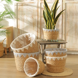 Detail of woven straw baskets with plastic lining and zigzag decorative edges