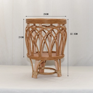 Detailed close-up of handmade woven rattan plant stand with tripod solid wood legs