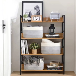 Three-piece set of woven cotton rope storage baskets on a wooden shelf for home organizing