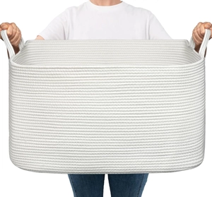 Close-up of a large white woven cotton rope basket with sturdy integrated handles