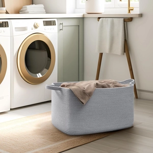 Close-up of woven cotton rope storage basket with sturdy handles and textured fabric