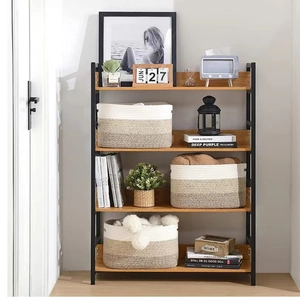 Three-tier stack of woven cotton rope baskets in cream and brown on a wooden shelf