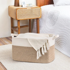 Detail of woven cotton storage basket showing bicolor jute texture and sturdy handles