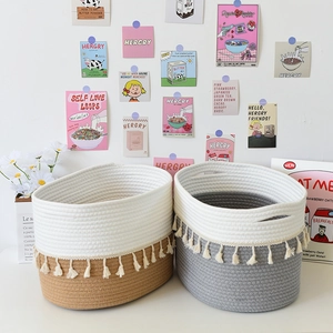 Close-up of cotton rope storage baskets with elegant tassels and durable handles