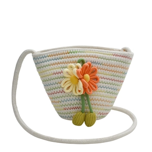 Handwoven cotton bucket bag with colorful wavy patterns and 3D floral accents for girls