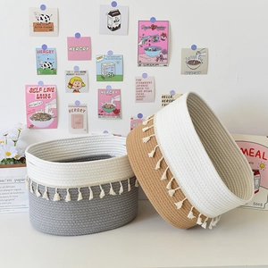 Set of two cotton rope storage baskets in grey and brown with elegant white tassels
