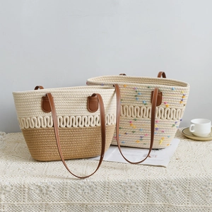 Detail of woven tote bags with leather straps and rainbow tufted texture on white lace